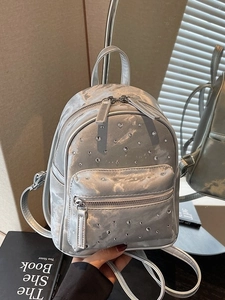 Silver rhinestone mini backpack with diamond pattern and adjustable faux leather straps