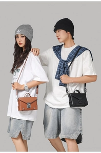 Detail of PU leather envelope bags with vintage silver locks and adjustable straps