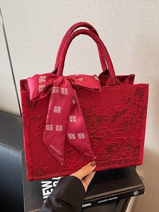 Elegant red Chinese wedding tote bag with floral jacquard and festive double happiness ribbon