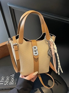 Fashion woven bucket bag with brown leather trim and silver metal twist lock closure