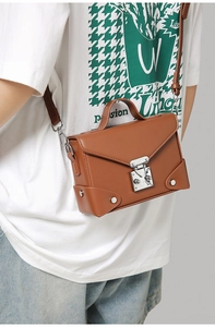 Detailed side view of a brown PU leather square crossbody bag with vintage silver lock