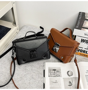 Detail view of vintage PU leather square bags with metal buckle and detachable strap