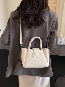 Chic off-white lychee grain leather crossbody bucket bag with round handle for women