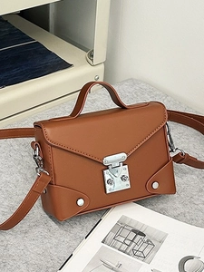 Classic caramel PU leather crossbody bag with envelope flap and silver hardware details