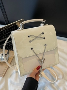 Chic beige convertible backpack with butterfly pendant and elegant metal chain accents