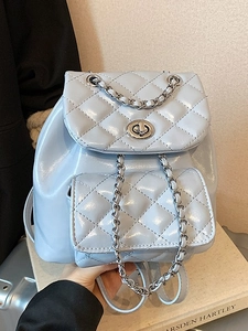 Light blue quilted chain backpack with silver twist lock and polished faux leather finish