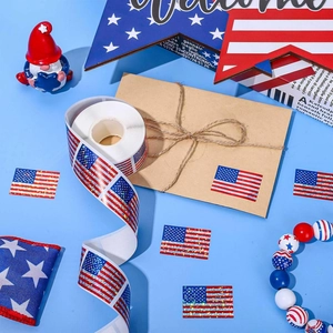 Glitter American flag stickers roll for gift boxes on a blue background with festive decor