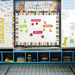 Classroom bulletin board border with colorful stripes and fruit-shaped teaching cards