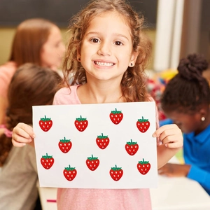 Detail showing red glitter strawberry stickers with green leaves on white cardstock