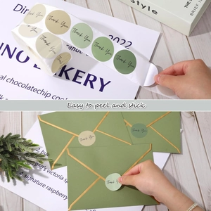 Detailed view of Morandi green Thank You stickers on envelopes with easy peel feature