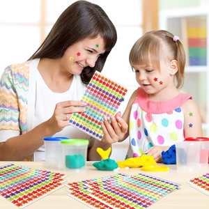 Family showing colorful glitter star stickers on face and hands for reward and decoration