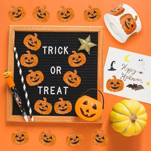 Flat lay of Halloween decoration set with laser pumpkin stickers and felt letter board