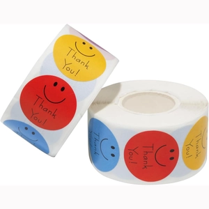 Roll of colorful smiley face stickers with Thank You text for gift packaging rewards