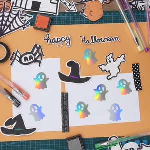 Macro view of holographic Halloween stickers with laser finish and spooky patterns