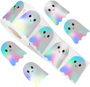 Macro detail of holographic ghost stickers roll with cute facial expressions for Halloween