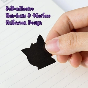 Macro shot of a self-adhesive Gengar silhouette sticker being peeled for Halloween decor