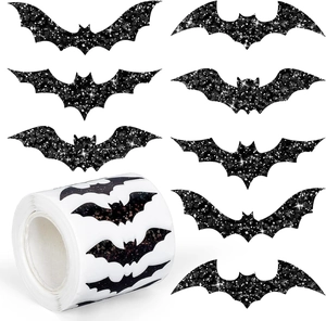 Detailed view of holographic bat-shaped Halloween stickers with glitter texture