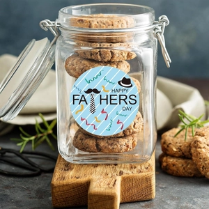 Detail of Happy Fathers Day sticker on a glass cookie jar with mustache and tie motifs