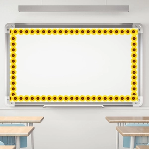 Close-up of bright sunflower bulletin board border trim applied to a classroom whiteboard