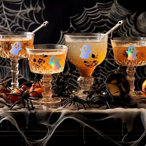 Close-up of holographic ghost stickers on vintage glasses for Halloween party décor