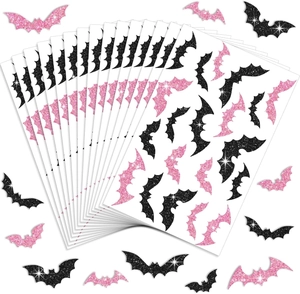 Detail of glitter Halloween bat stickers in pink and black for festive DIY decoration
