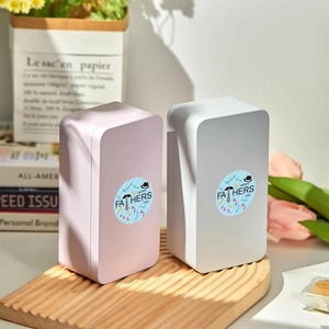 Father's Day round stickers on rectangular metal gift boxes in pink and grey