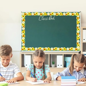 Classroom blackboard decorated with sunflower and white daisy floral border stickers