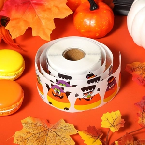 Close-up of Halloween candy corn stickers roll with spooky monster characters