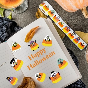 Close-up of Halloween character stickers featuring pumpkins and vampires on a roll
