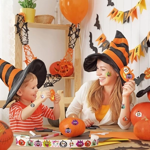 Close-up of Halloween cartoon stickers roll used for pumpkin decor and family DIY activities