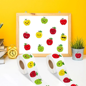 Close-up of colorful cartoon apple stickers in rolls with diverse cute facial expressions