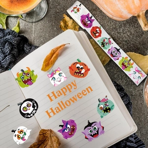 Close-up of cute Halloween stickers on notebook with pumpkin and autumn leaf decor