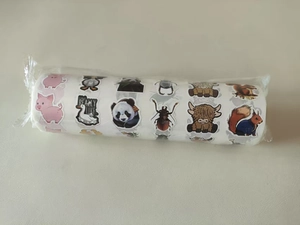 Roll of animal stickers in original plastic wrap showing cute ducks and pig designs