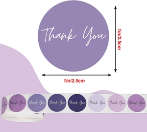 Detail showing 1-inch purple gradient Thank You stickers on a roll for gift packaging