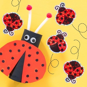 Detail of laser ladybug stickers with creative children DIY craft on yellow background