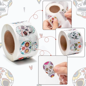 Macro detail showing colorful sugar skull stickers peeling off the adhesive roll