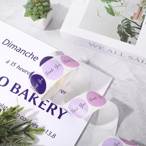 Macro shot of purple round 'Thank You' stickers for gift boxes and envelope seals