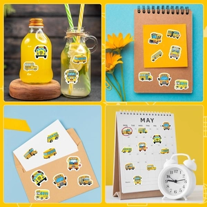 Detailed application of cartoon school bus stickers on notebook and water bottle surfaces
