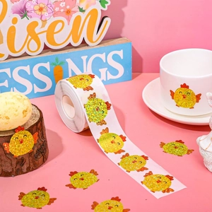 Detailed holographic laser yellow chick stickers on a roll and applied to a white cup