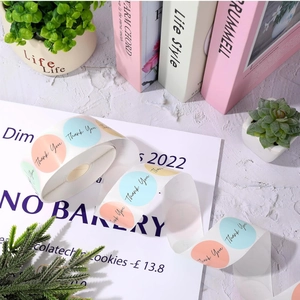 Close-up of colorful round Thank You labels roll for gift packaging and decoration