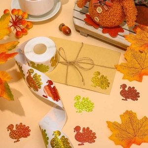 Detail view of festive glitter turkey stickers on envelopes with warm autumn decorations