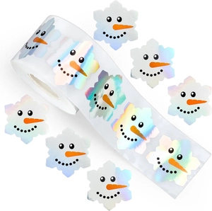 Holographic snowman snowflake stickers on a roll for festive gift decoration
