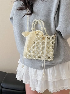 Handmade woven pearl handbag with lace bow and elegant satin drawstring lining