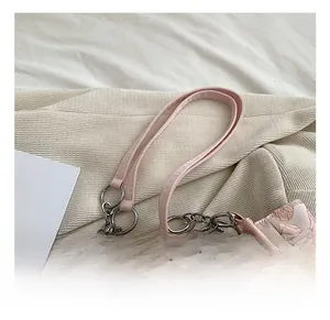 Close-up of pink heart jacquard tote bag with beaded chain and leather handle