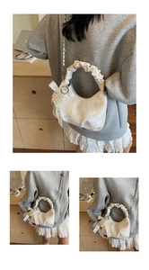 Detail of white pleated handbag with pearl heart charm and metallic chain strap