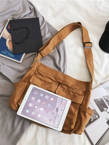 Brown canvas messenger bag for students with large capacity and multi-pocket design