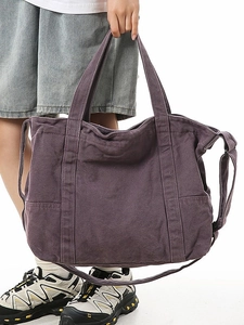 Large dark purple canvas tote bag with shoulder strap and side pockets for commuting