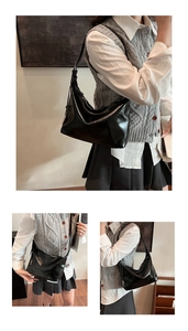 Three-way side view of the black glossy pleated underarm bag worn on the shoulder