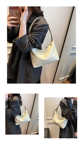 Detail of cream hobo bag showing textured faux leather finish and casual shoulder strap style