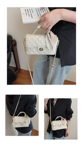 Detail of white quilted crossbody bag with golden twist lock and decorative silk scarf